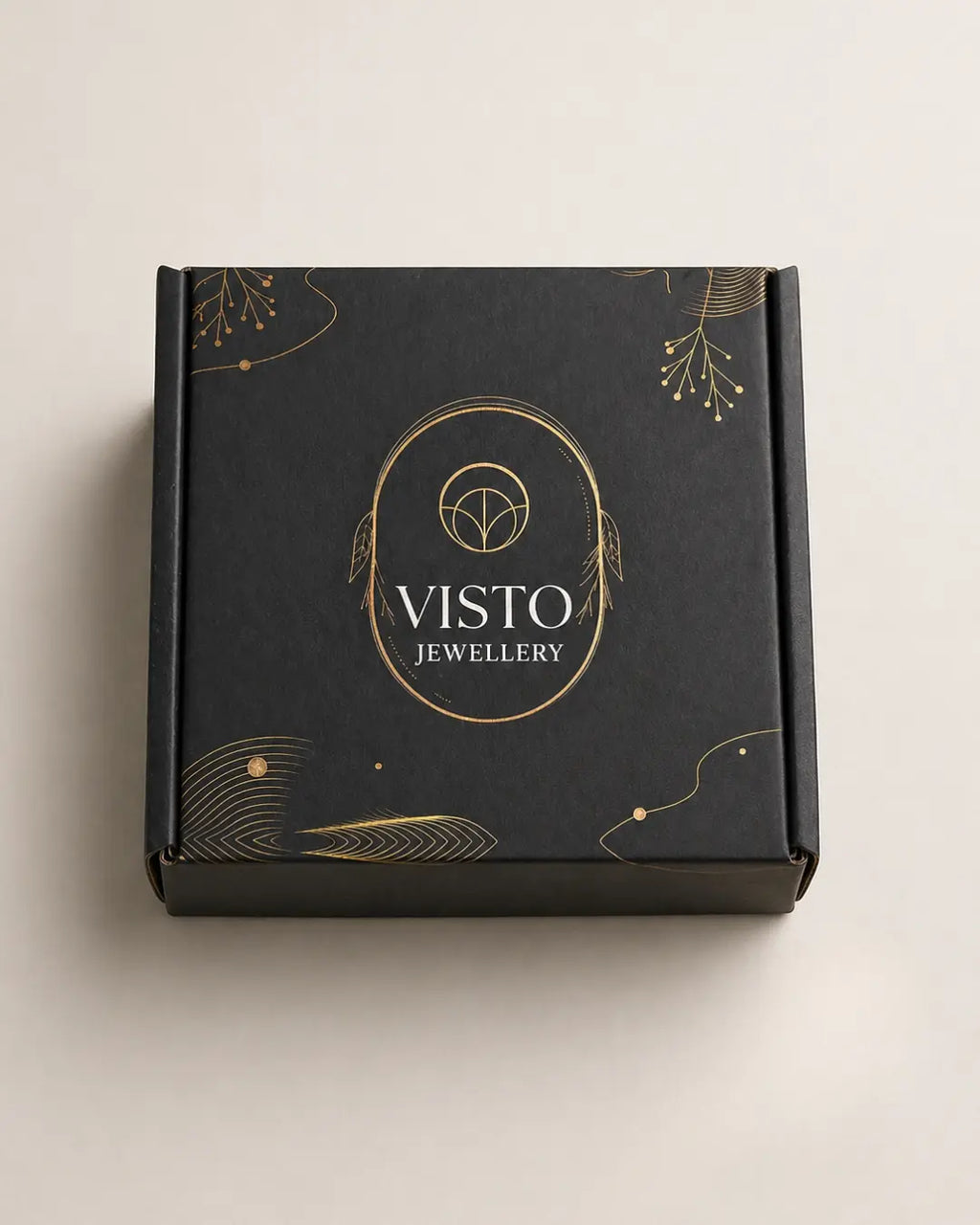 Black box with gold accents and 'Visto Jewellery' branding on a light beige background