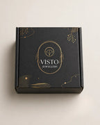 Black box with gold accents and 'Visto Jewellery' branding on a light beige background