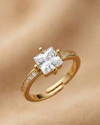 Gold ring with a large diamond on a gold background