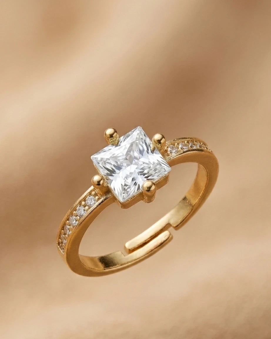 Gold ring with a large diamond on a gold background